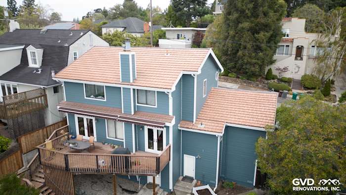 Home exterior featuring James Hardie Evening Blue siding and rustic white trim in Oakland, CA