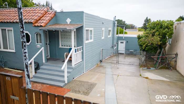 Home exterior featuring Boothbay Blue HardiePlank siding and Arctic White trim in Brisbane, CA