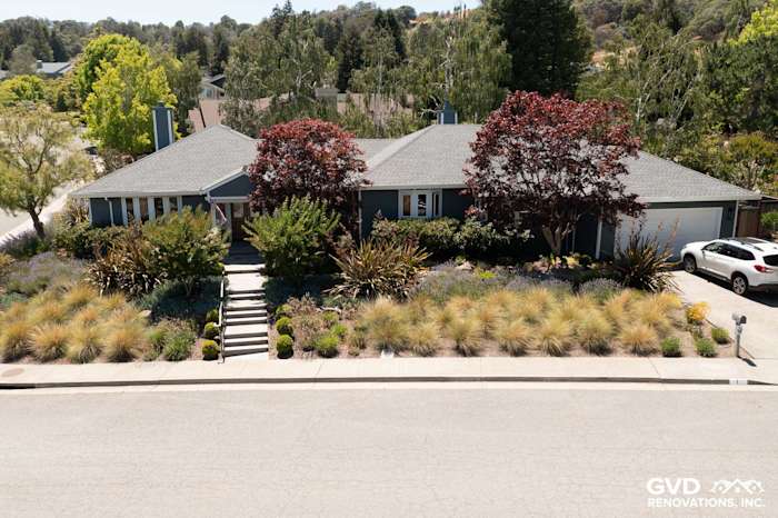 Single-story house in San Rafael with James Hardie Evening Blue siding and Arctic White trim, landscaped front yard