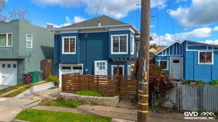 Bold Evening Blue James Hardie siding with Arctic White trim on a remodeled Oakland home exterior