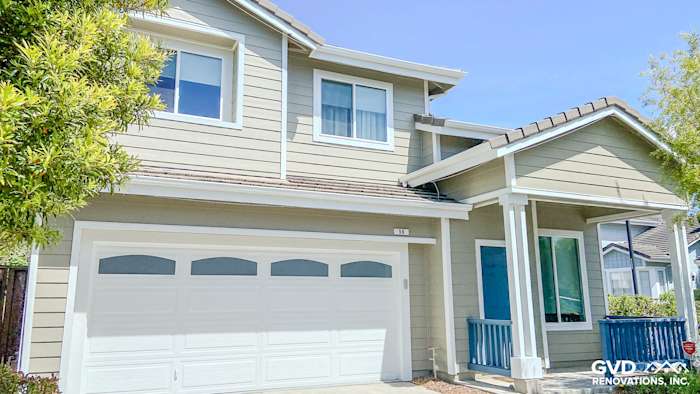 Monterey Taupe James Hardie siding with Arctic White trim and new Anlin windows on a suburban home in Richmond, CA