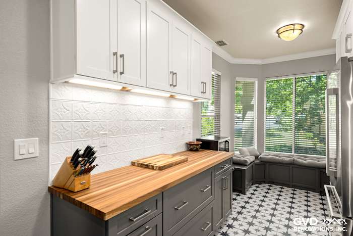 Updated kitchen featuring gray cabinetry, wood countertop, and geometric floor tiles in Folsom, CA