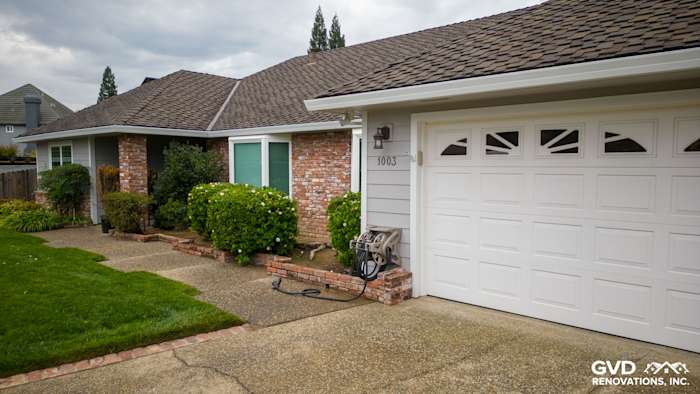 Updated home exterior featuring James Hardie Cedarmill Siding, Milgard Windows, and landscaped front yard in Roseville