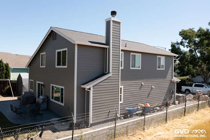 Rohnert Park exterior featuring James Hardie Aged Pewter lap siding and Arctic White trim with chimney