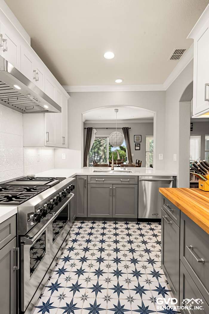 Modern kitchen remodel in Folsom with gray cabinets, white quartz countertops, and patterned tile floor