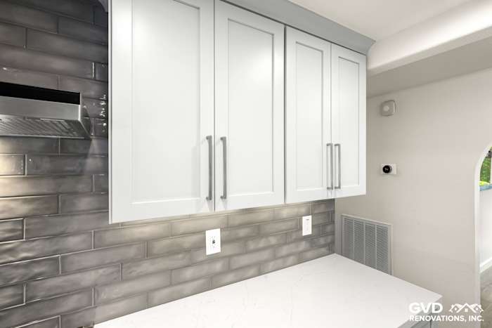 Modern kitchen featuring white cabinets, gray subway tile backsplash, and quartz countertop detail in Rocklin remodel