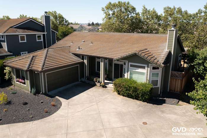 Petaluma home featuring Mountain Sage James Hardie lap siding and Cobble Stone trim with a sloped roof