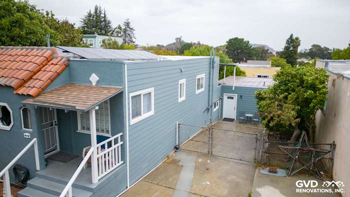 CedarMill HardiePlank lap siding in Boothbay Blue with Arctic White trim on a Brisbane home exterior