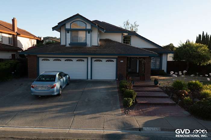 Charming home exterior in Hercules with James Hardie Arctic White siding and brick accents