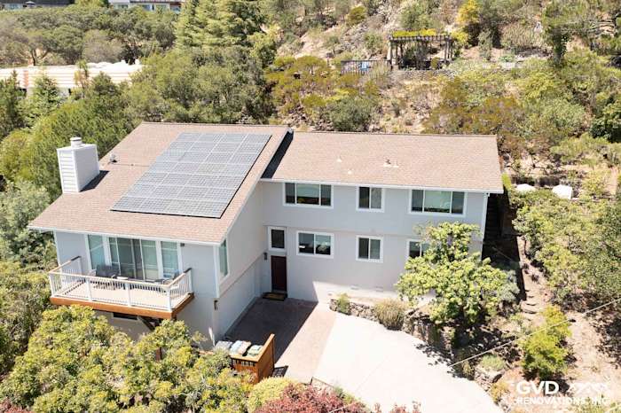 Modern home exterior in San Rafael featuring James Hardie siding in Cobble Stone and Andersen windows, with solar panels