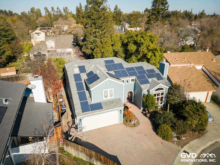 Home exterior featuring Boothbay Blue James Hardie siding and solar panels in Davis, CA