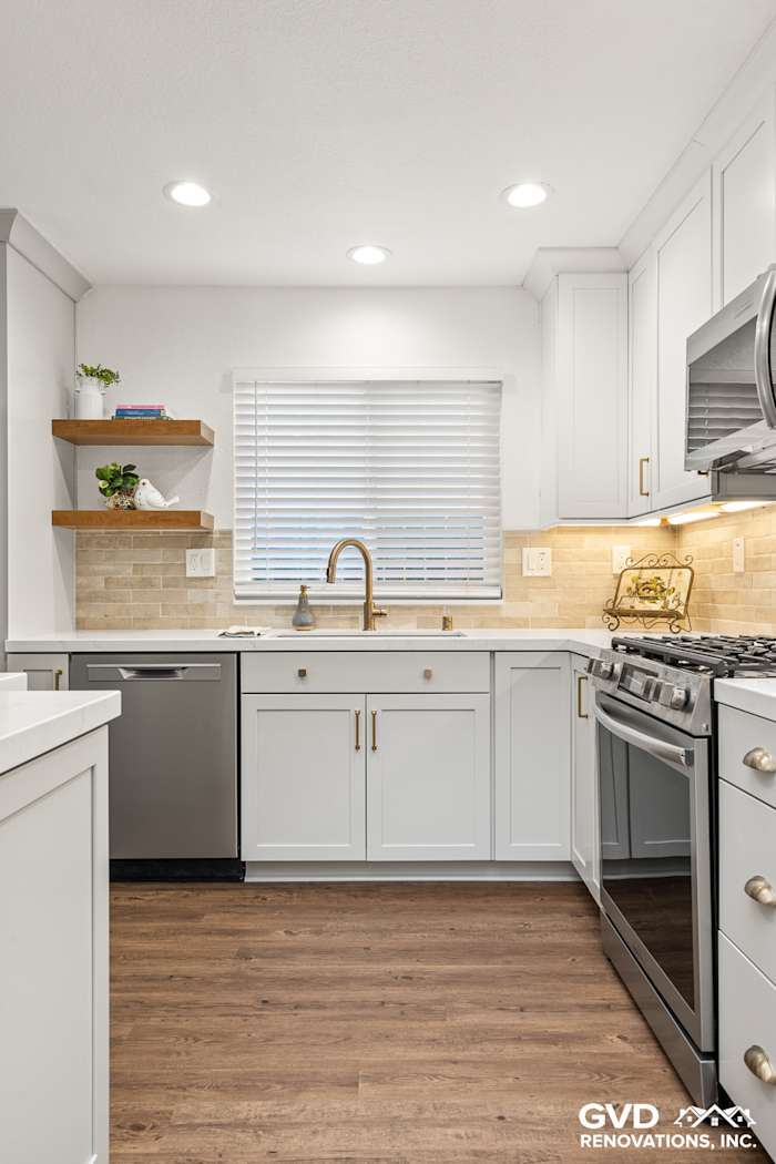 Modern kitchen in Roseville featuring Waypoint cabinetry, Vadara Naurelle countertops, and MSI Brickstone Ivory backsplash