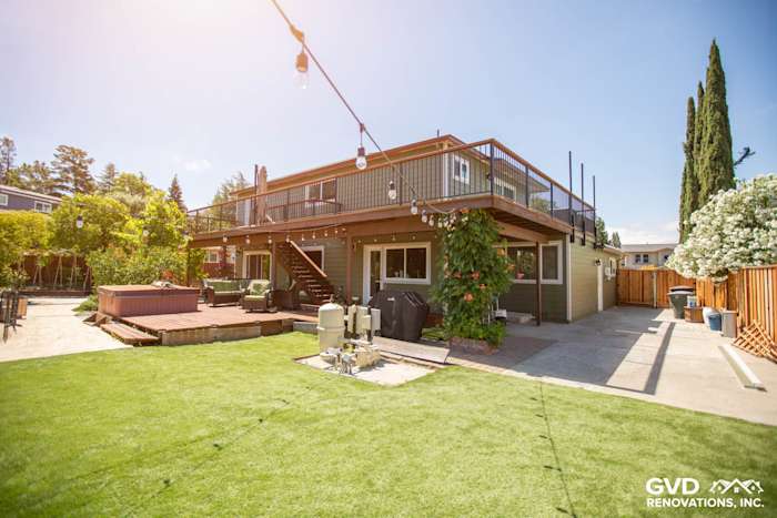 Transformed Pleasanton home exterior with James Hardie siding, spacious deck, and landscaped yard