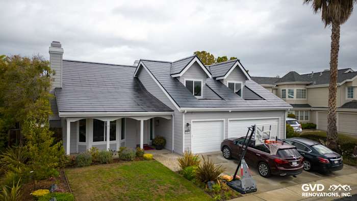 New Pearl Gray James Hardie siding and Arctic White trim adorn a Foster City home exterior