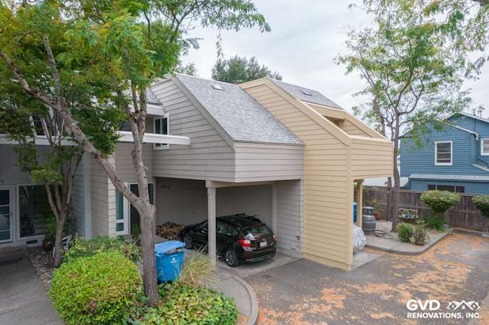 Modern quadplex exterior featuring James Hardie siding in light beige, gray roof, and landscaped driveway in Santa Rosa