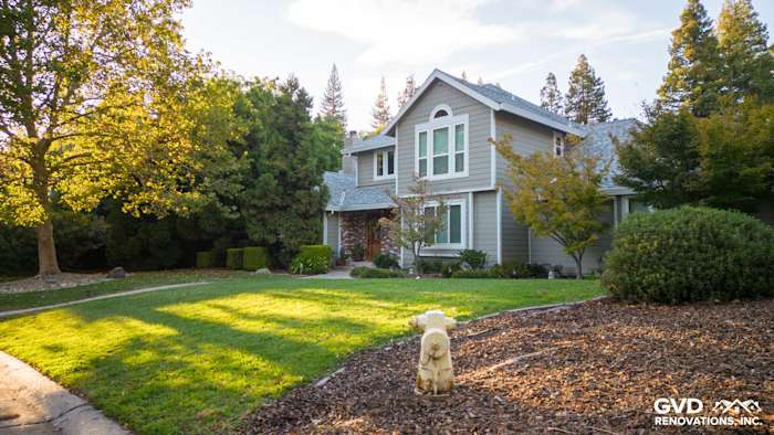 Fair Oaks home featuring James Hardie Monterey Taupe siding and Arctic White trim with lush landscaping
