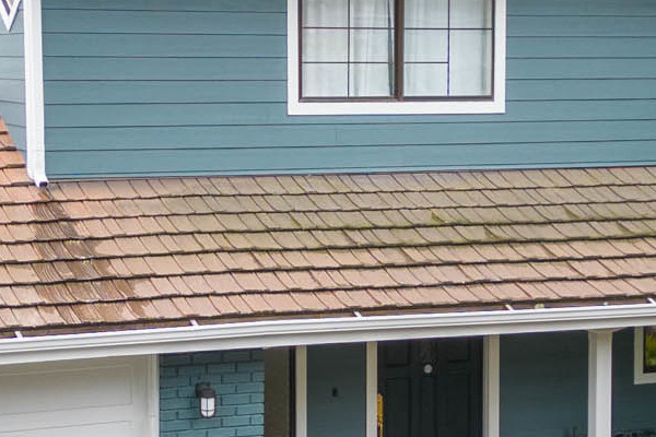 Oakland home exterior featuring Evening Blue Cedarmill HardiePlank siding and Rustic Grain Arctic White HardieTrim