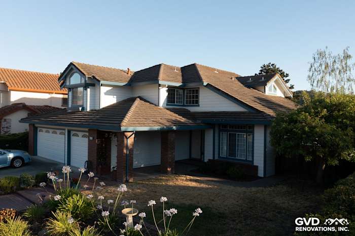 Charming home exterior with Arctic White James Hardie siding and blue accents in Hercules, CA