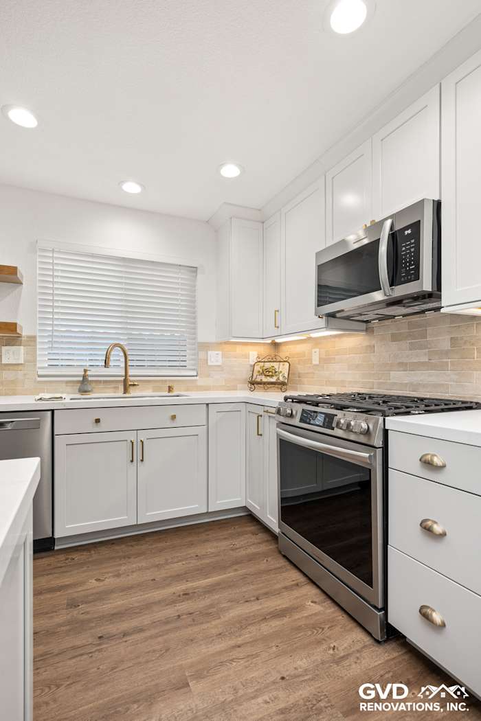 Modern Roseville kitchen featuring Waypoint Cabinets, Vadara Naurelle countertops, and MSI Brickstone Ivory backsplash