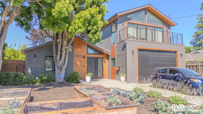 Modern home exterior featuring James Hardie V Groove Artisan Siding in gray and warm wood accents in San Jose