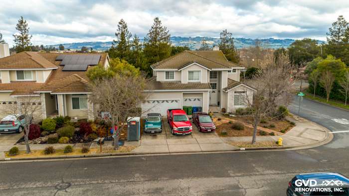 Updated home exterior in Petaluma with James Hardie Cobble Stone siding and Arctic White trim