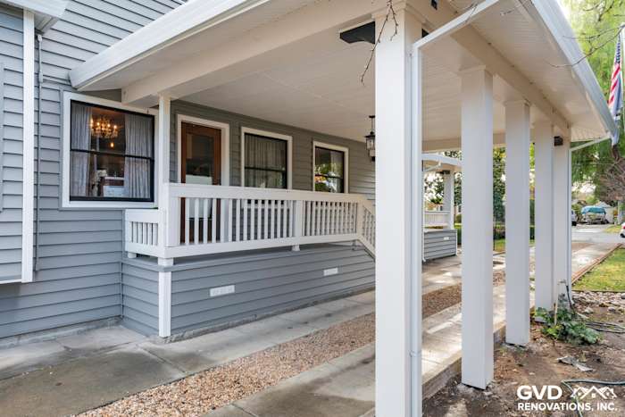 Transformed home exterior featuring new gray vinyl siding and white porch railings in Dixon, CA