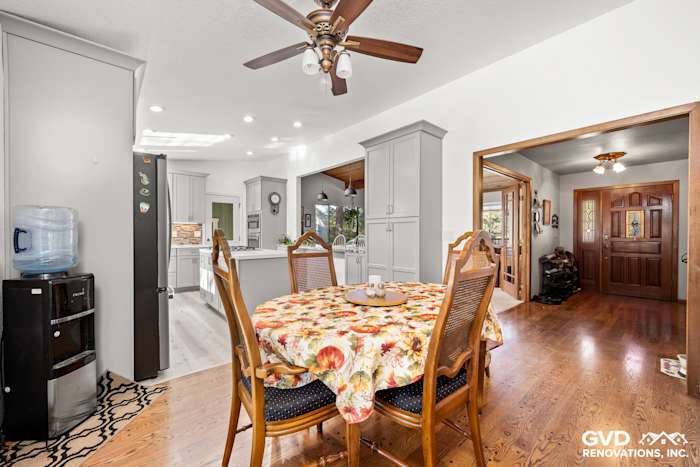 Bright kitchen remodel in Greenwood with a cozy dining area, wooden table, and modern cabinetry