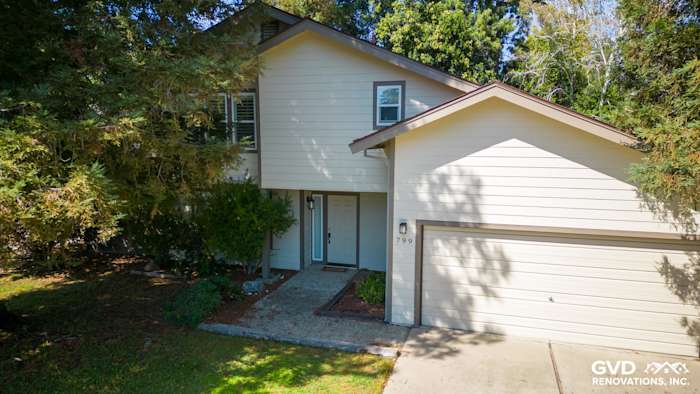 Two-story home exterior featuring James Hardie siding and HardieTrim, surrounded by trees in Sacramento