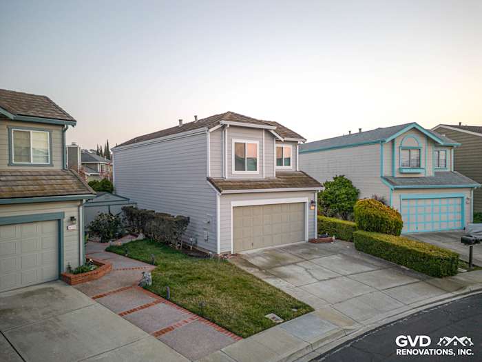 Modern home exterior in Fremont, CA featuring James Hardie Pearl Gray siding and Anlin windows