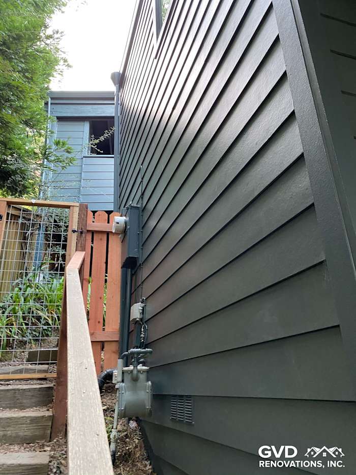 Dark gray James Hardie siding installed on a home in Mill Valley, showcasing a clean, modern look