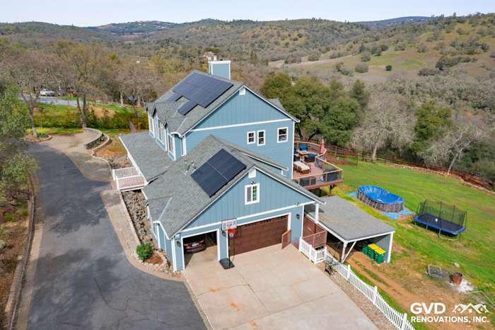 Stylish Shingle Springs home with new blue James Hardie siding and solar panels, showcasing modern upgrades