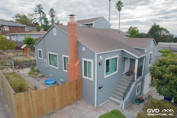 Gray Slate James Hardie siding with Arctic White trim on modern Richmond, CA home exterior, featuring upgraded windows
