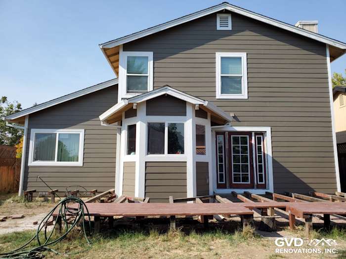 Newly installed James Hardie siding in earthy gray on a two-story Santa Rosa home with framed porch