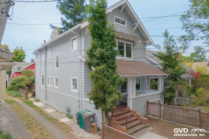Two-story Oakland home showcasing Light Mist Hardie Shingle Siding with Arctic White trim and inviting porch