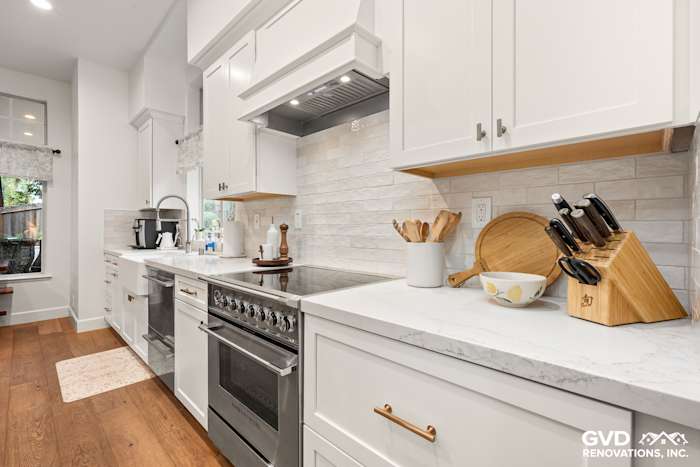 Modern kitchen remodel with Waypoint cabinets, custom Vadara Bronzo countertops, and stainless steel appliances in Folsom