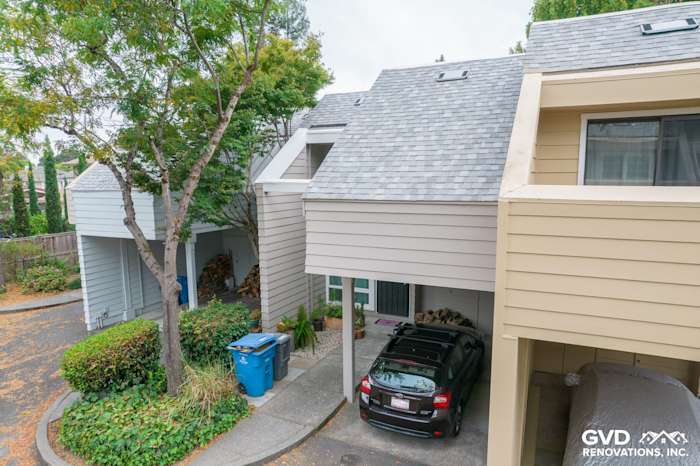 Updated quadplex exterior featuring James Hardie siding, gray shingles, and landscaped front entrance in Santa Rosa