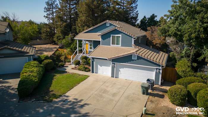 Updated home exterior in Dixon with new siding, Anlin windows, and a refreshed deck