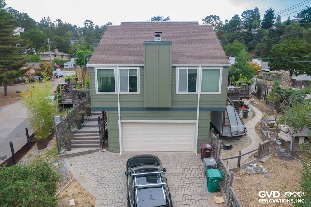 Oakland home exterior featuring Mountain Sage vertical siding and CobbleStone trim with Anlin Catalina windows