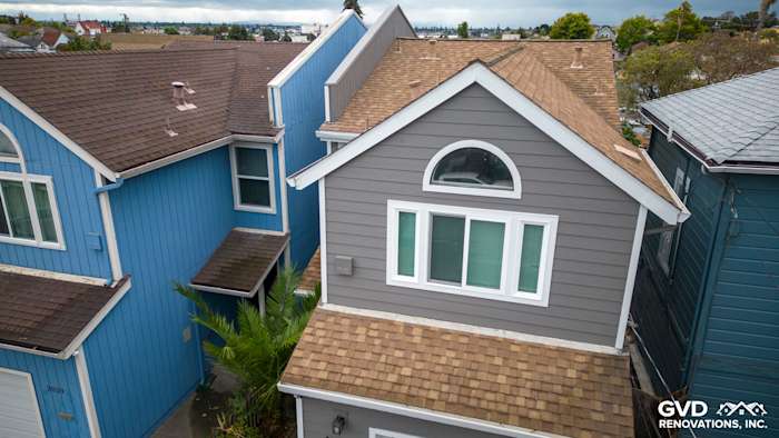 Aerial view of a home featuring Aged Pewter James Hardie siding and Arctic White trim in Oakland, CA