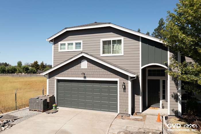 Two-story home exterior featuring James Hardie Aged Pewter siding and Arctic White trim in Rohnert Park