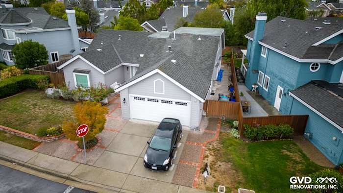 Newly installed Pearl Gray James Hardie siding and Milgard windows on home exterior in Foster City