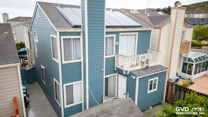 Daly City home with Evening Blue HardiePlank lap siding and solar panels on the roof