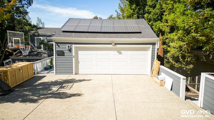 Home exterior in Orinda featuring James Hardie Night Gray siding, Arctic White trim, and solar panels