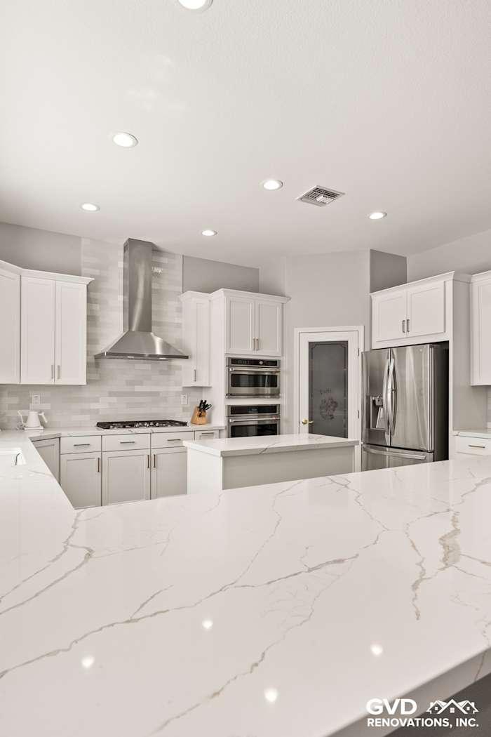 Modern Roseville kitchen with diamond cabinets, MSI marble countertops, and stainless steel appliances. Sleek, elegant design