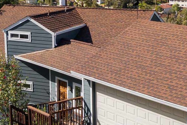 Home exterior featuring James Hardie Plank siding, new windows, and a brown shingle roof in Oakland, CA