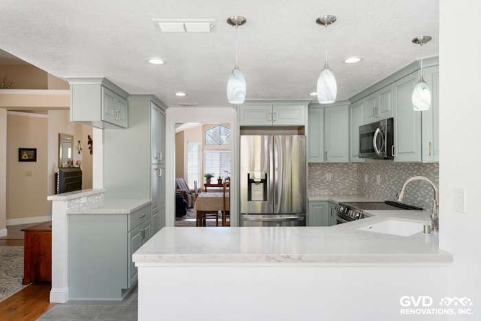Modern kitchen remodel in Cameron Park featuring light blue cabinets, quartz countertops, and stainless steel appliances