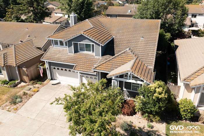 Home exterior in Petaluma with James Hardie Night Grey siding, Arctic White trim, and a fresh roof