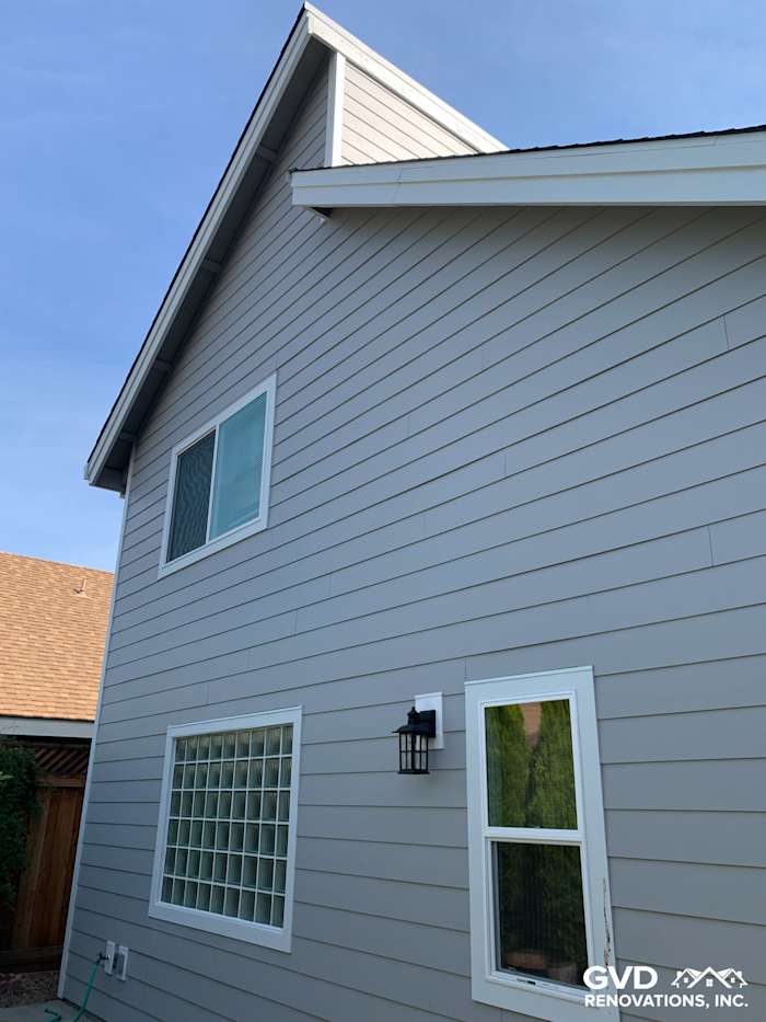 Pearl Gray HardiePlank siding with Arctic White trim on a Napa home, showcasing new windows and clean lines