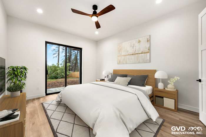 Bright bedroom with a queen bed, modern decor, large windows, and natural light in new construction home