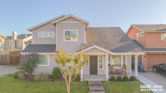 Modern home exterior featuring James Hardie Pearl Gray lap siding, Arctic White trim, and Anlin windows in Petaluma, CA